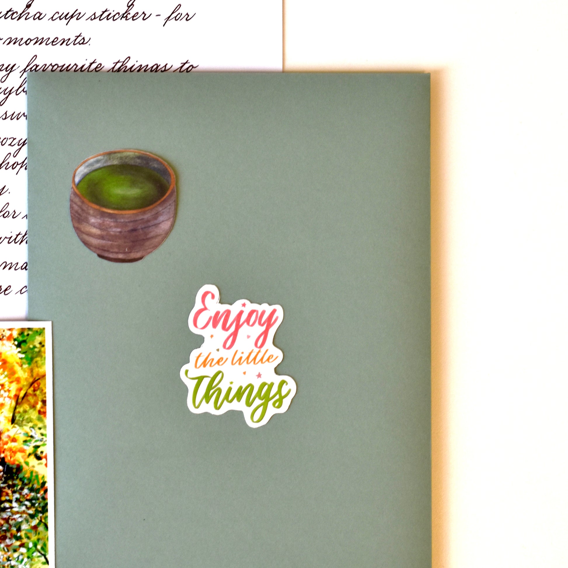 Flatlay of HerPenpals postcards and stickers with warm cozy aesthetic