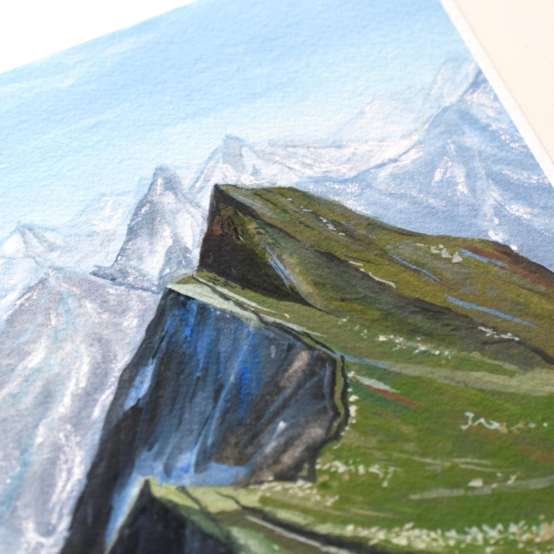“Verdant Peaks” mountain landscape in layered greens and blues — close view of the gouache textures and calm colour palette.