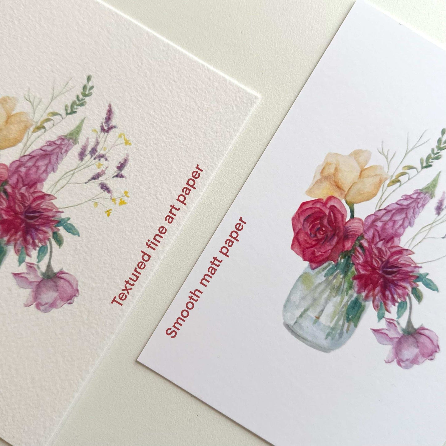 Side-by-side comparison of “Watercolour Flowers Vase” postcards labeled Smooth Matte and Textured Fine Art paper — showing finish and texture difference by HerPens.