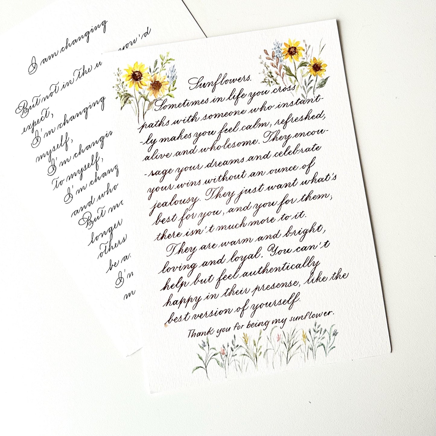 Full page handwritten calligraphy letter with rich watercolor floral border decoration