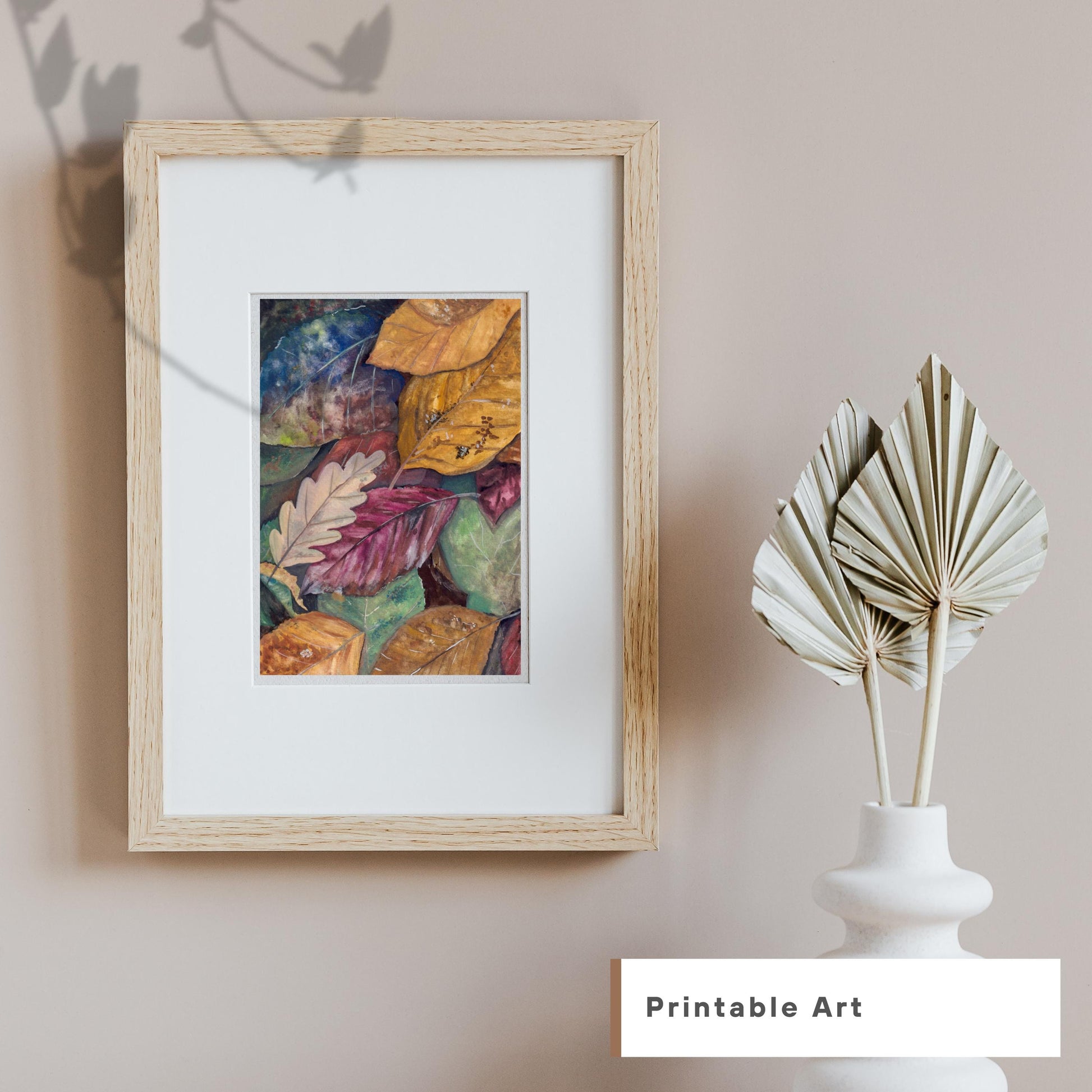 Gouache fall leaves digital print framed against a soft beige wall with minimalist vase décor, autumn-inspired home artwork, HerPens
