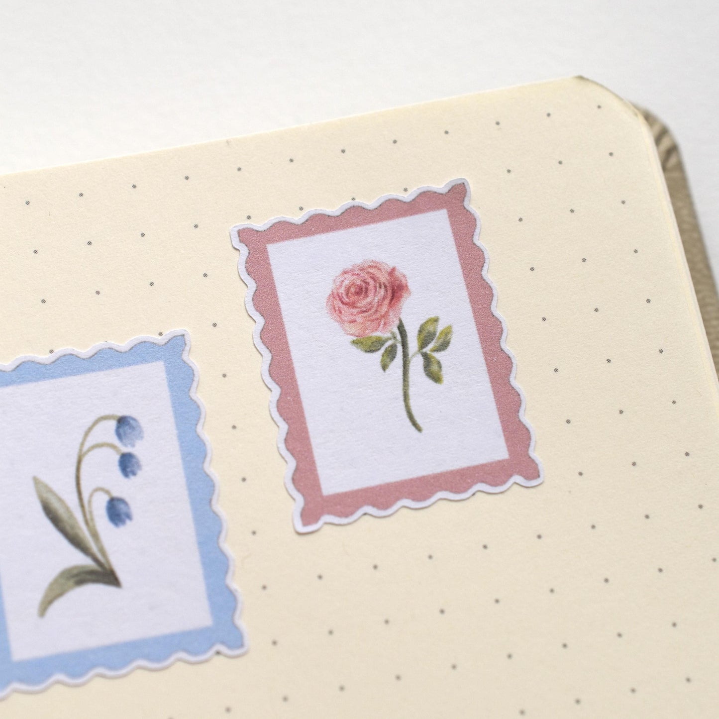 Decorative stickers with floral designs on a journal by herpens