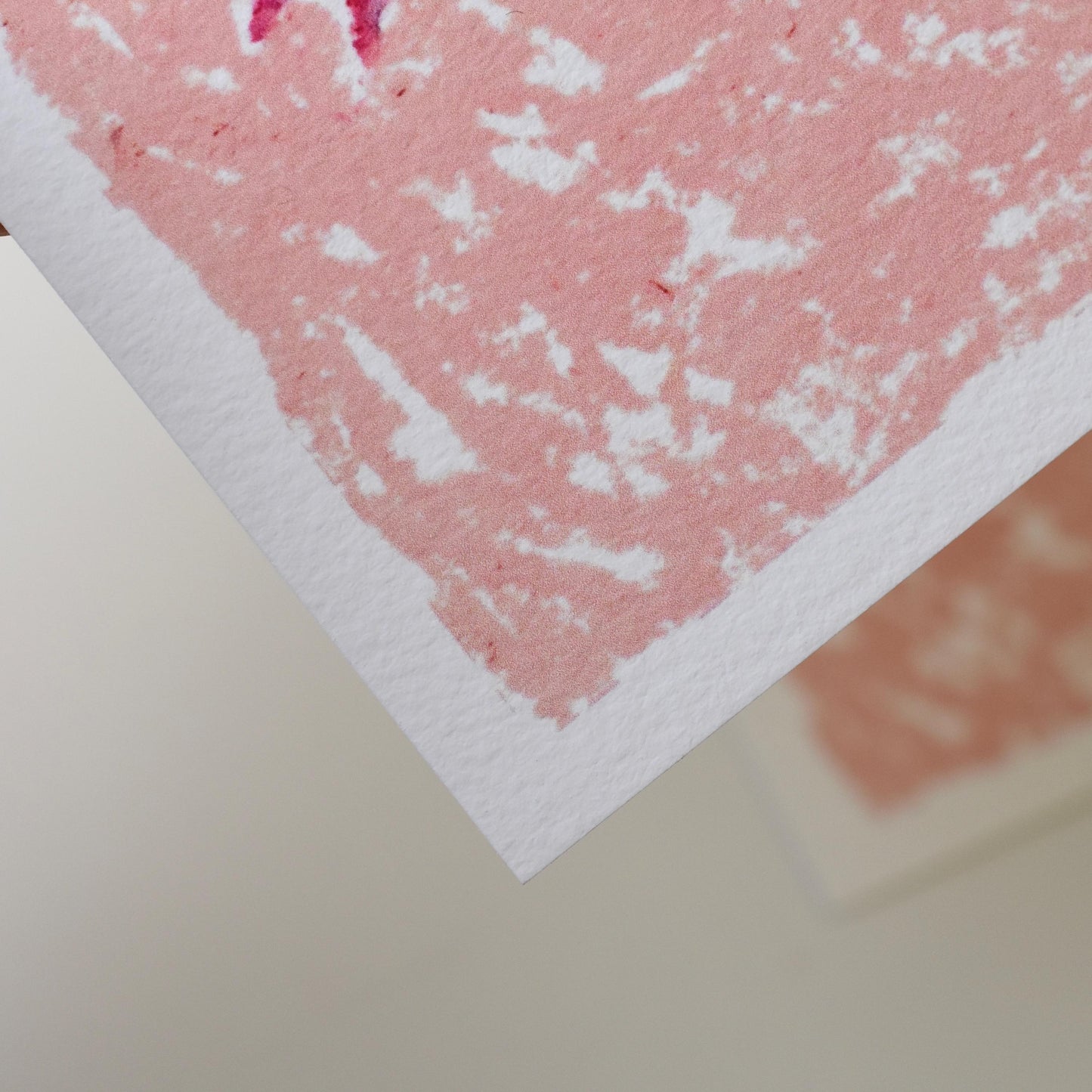 Detail of lower corner of floral oil pastel print, highlighting paper texture and soft pastel layering