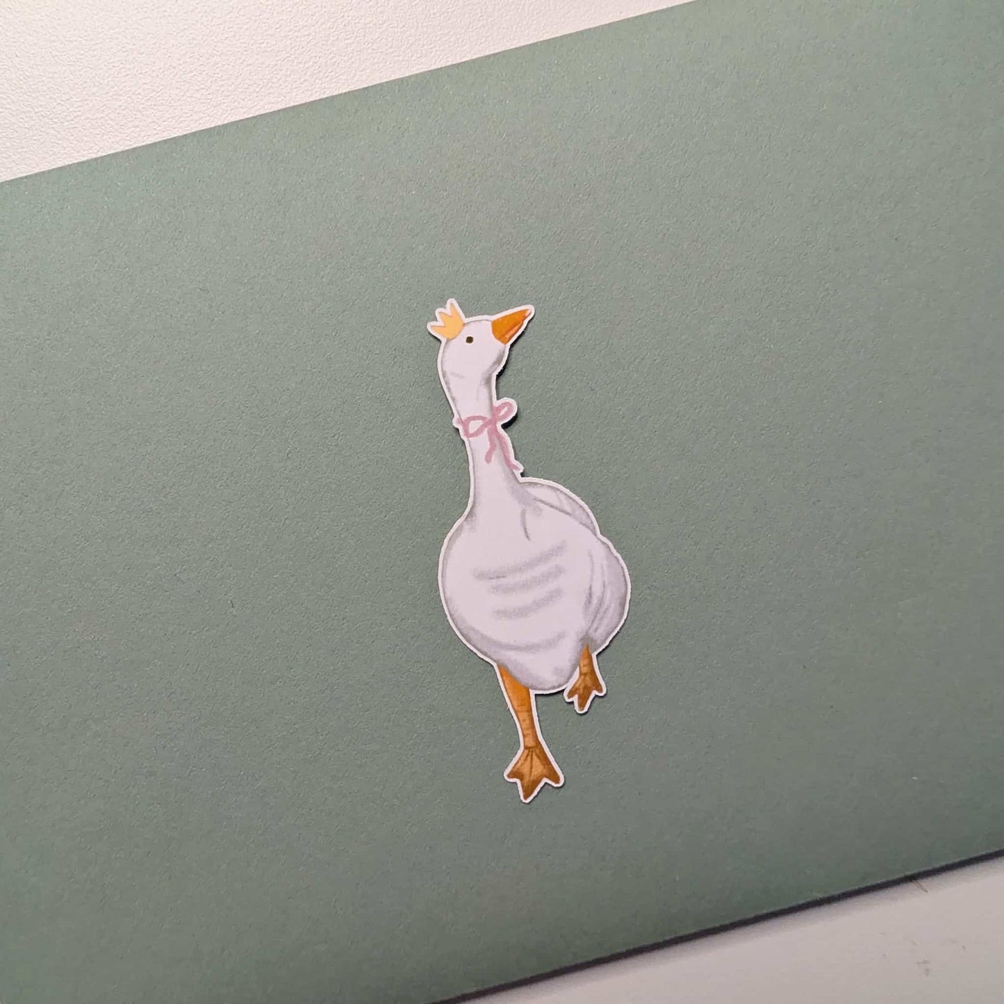 Cartoon duck sticker on a green card
