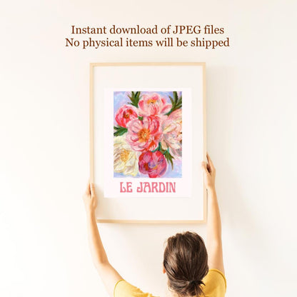 Hand holding “Le Jardin” digital floral artwork — delicate oil pastel flowers in soft pink and green hues, printable wall art.