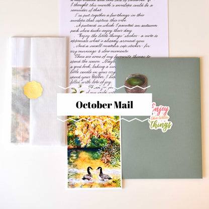 Collection of stationery items including a card with ducks, a letter, and a green envelope on a white background.