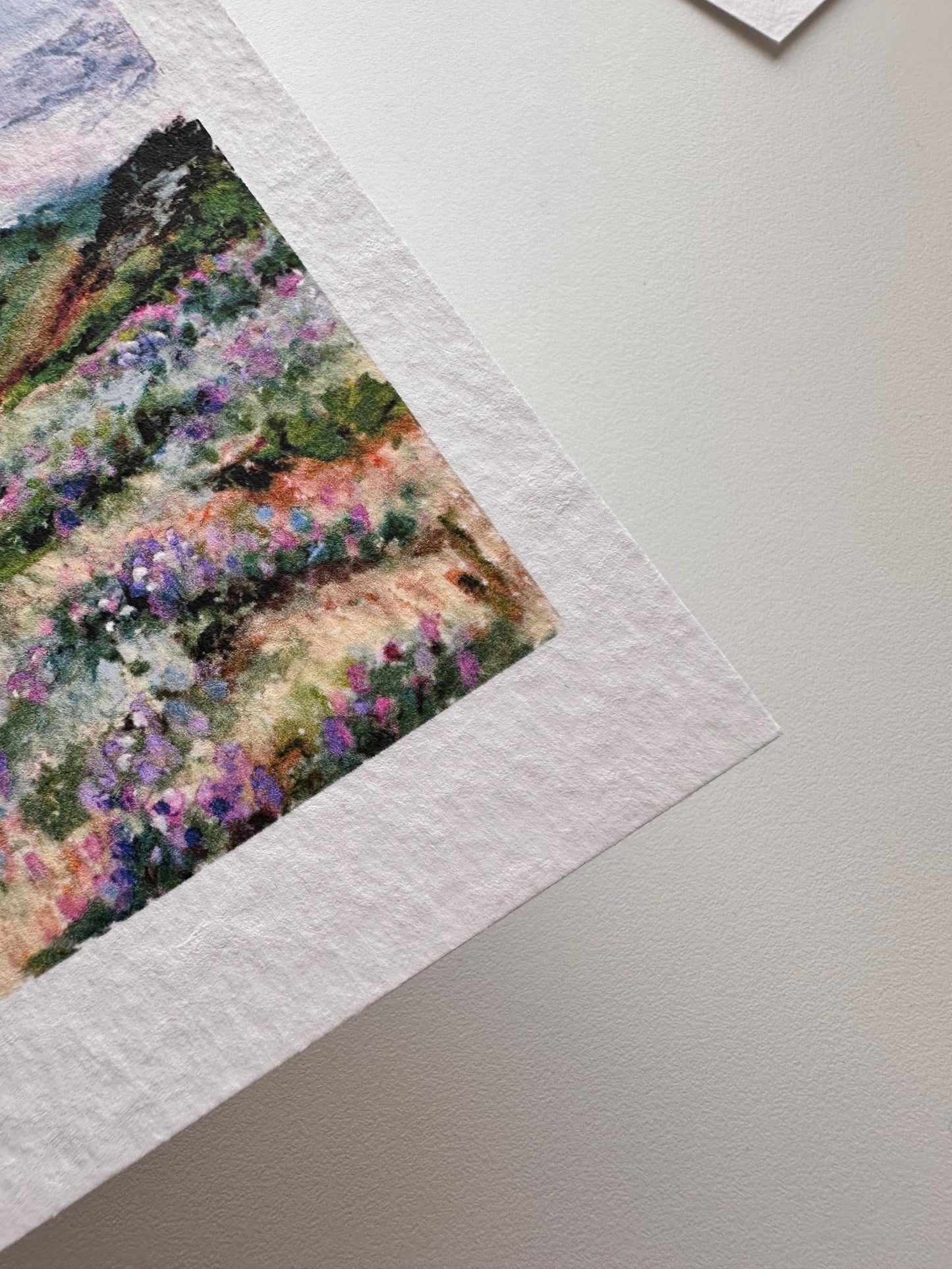 Close-up of hillside wildflower oil pastel postcard by HerPens — showing textured fine art paper surface and detailed pastel brushwork.
