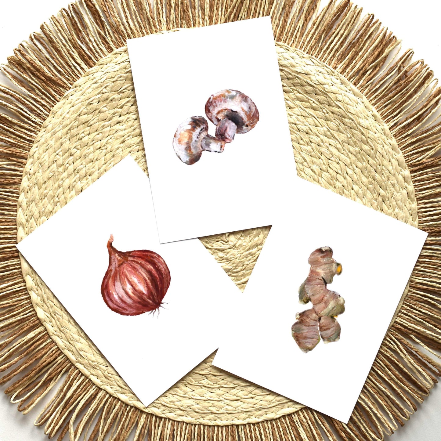 Set of three cards with mushroom illustrations on a woven mat