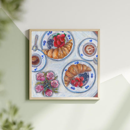 Flatlay of oil pastel breakfast digital artwork showing croissants, berries and blue dishes, printable kitchen art on soft green backdrop, HerPens
