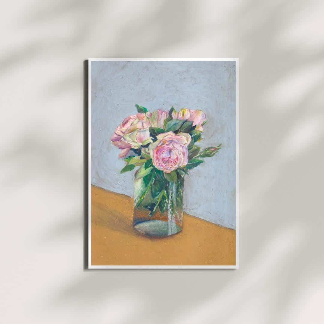 Framed artwork of a still life with pink flowers in a glass vase on a neutral background