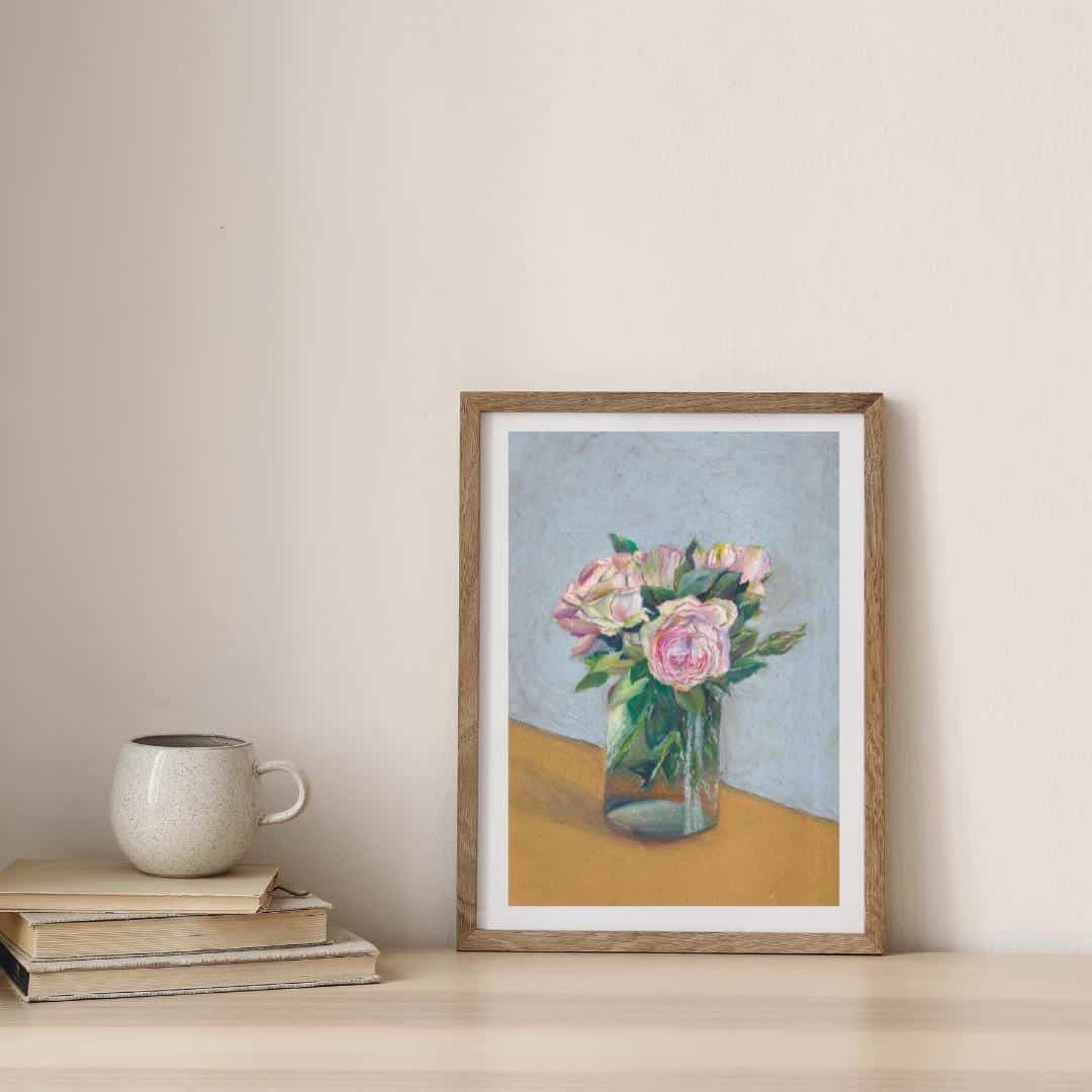 Framed artwork of a still life with flowers on a wooden shelf.