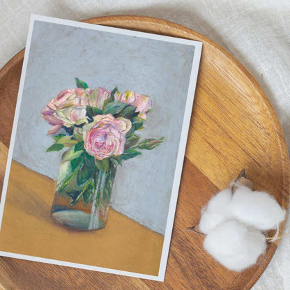 Postcard with a floral design on a wooden surface