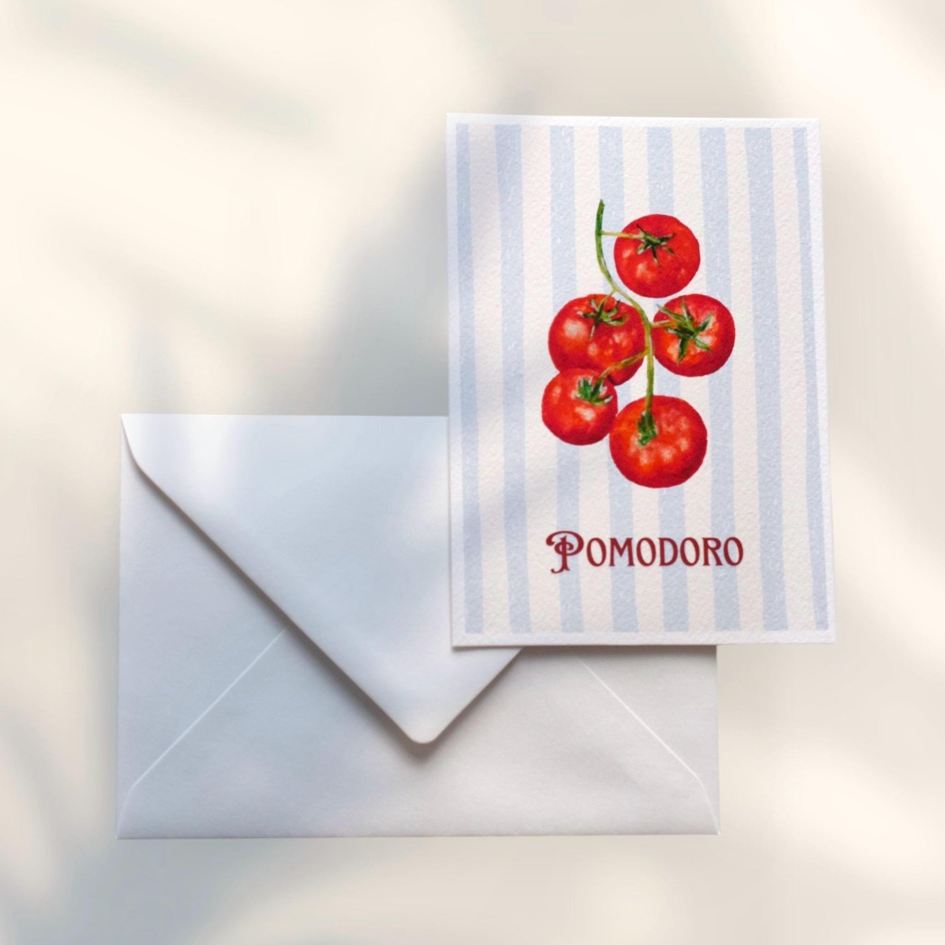 “Pomodoro” A6 postcard on smooth matte paper paired with white envelope — tomato oil pastel artwork by HerPens, ready for gifting or mailing.