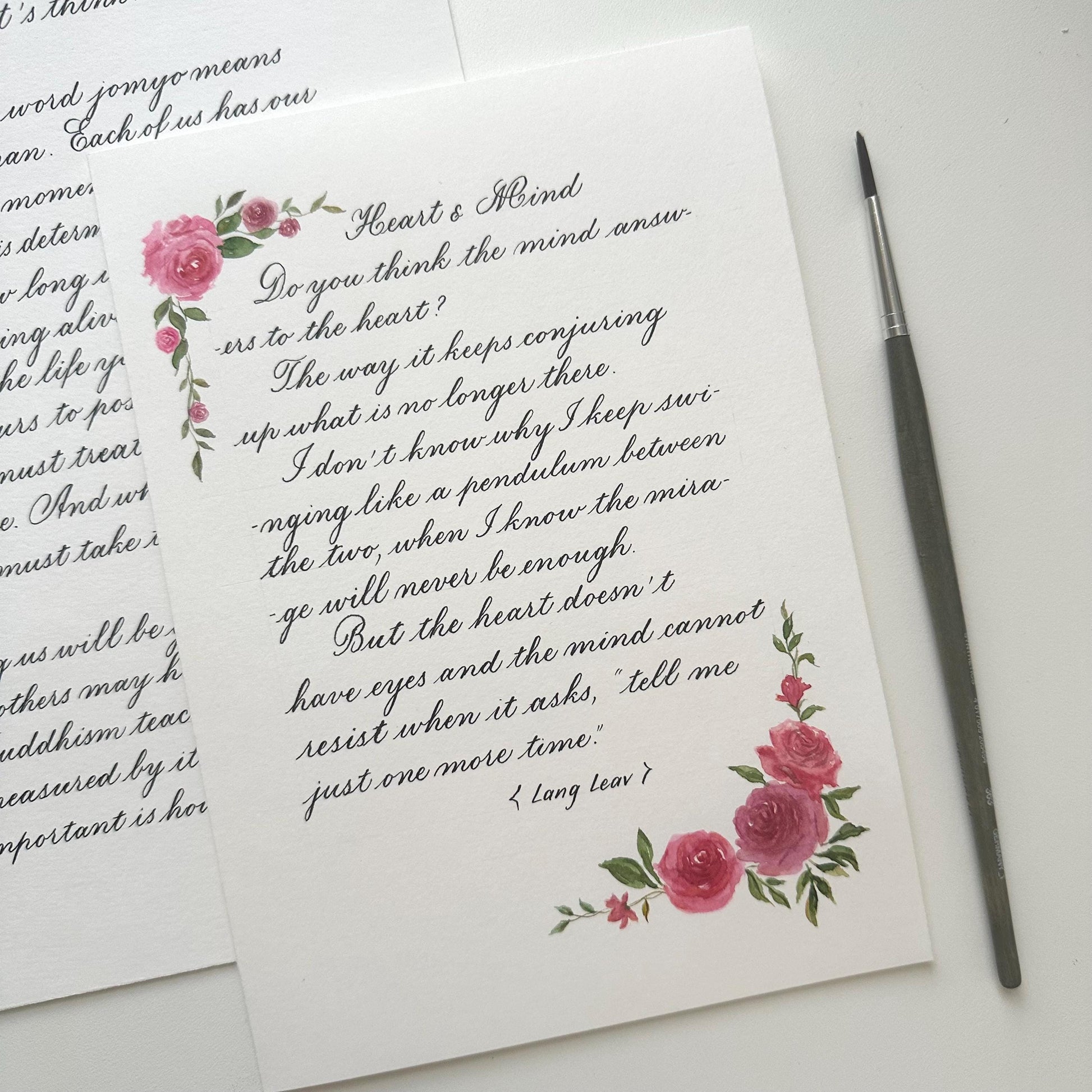 Romantic handwritten calligraphy love letter surrounded by colorful watercolor flowers
