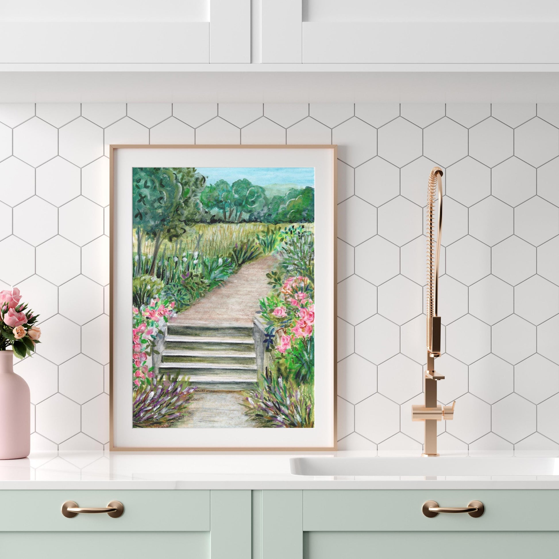 Framed Summer Park digital download displayed on a kitchen wall with hexagon tiles, watercolor crayon landscape art print with path and flowers, HerPens