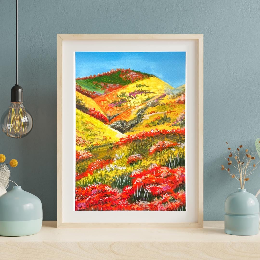 Framed “The Blooming Path” gouache print styled with soft florals — vibrant blooming garden scene for cozy home decor.