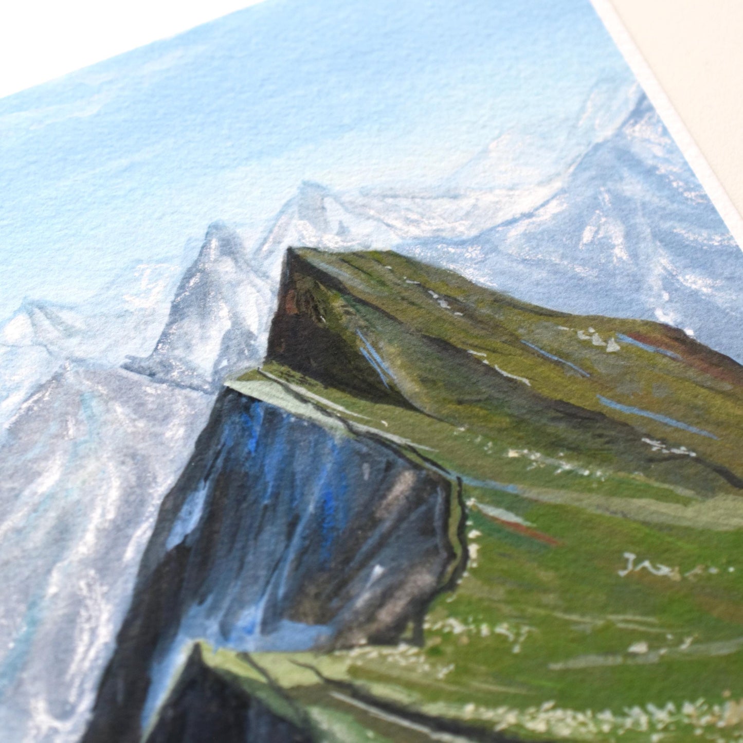 “Verdant Peaks” mountain landscape in layered greens and blues — close view of the gouache textures and calm colour palette.
