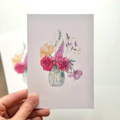 “Watercolour Flowers Vase” A6 art postcard held in hand — gentle floral watercolor painting printed on fine art paper by HerPens.