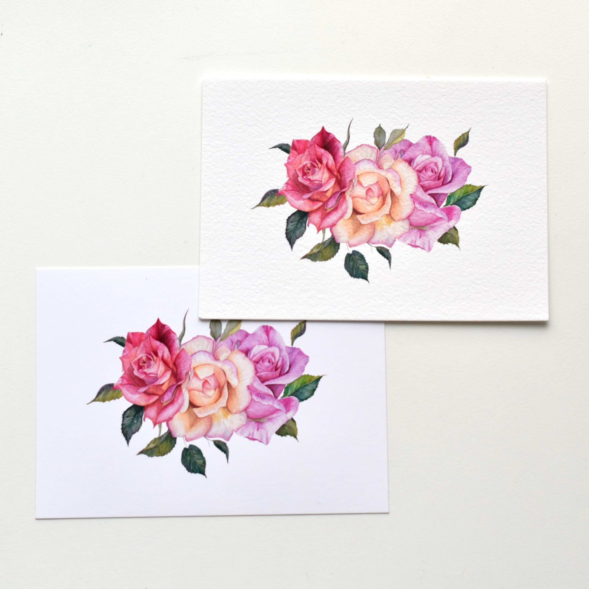 A6 watercolor roses postcards shown side by side on matte and textured paper, comparing print surfaces and floral details, HerPens